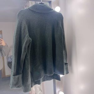 Dark green turtleneck sweater
